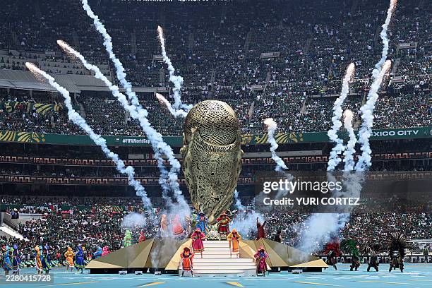 Artist perform during the opening ceremony ahead of the 2026 World Cup Group A football match between Mexico and South Africa at the Mexico City...