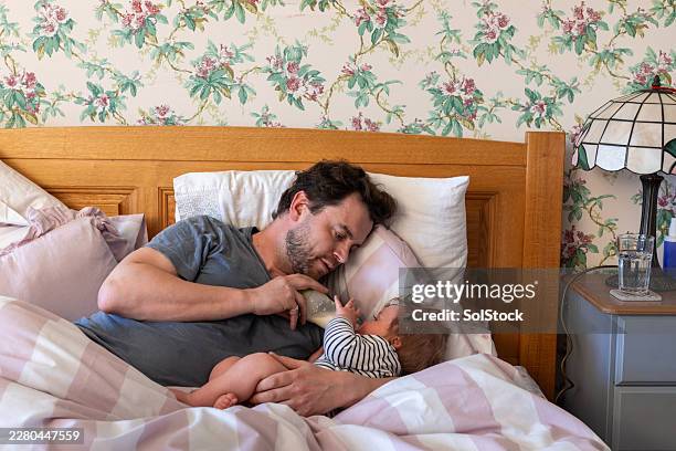 feeding son milk in the morning - real family stock pictures, royalty-free photos & images