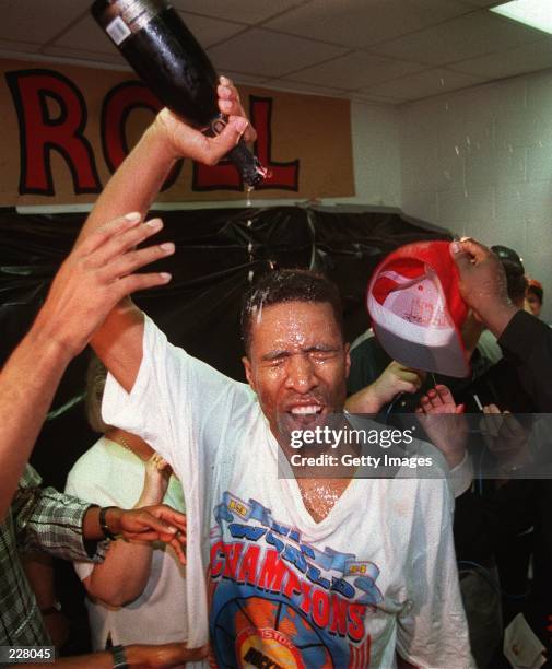 HOUSTON ROCKET KENNY SMITH POURS CHAMPAGNE OVER HIMSELF FOLLWING THE ROCKET''S 90-84 VICOTRY OVER THE KNICKS FOR THE NBA CHAMPIONSHIP AT THE SUMMIT...