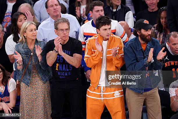 Christine Taylor, Ben Stiller and Timothée Chalamet look on during the first quarter between the New York Knicks and the San Antonio Spurs in Game...