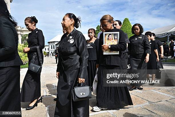 Members of the public arrive at the Palace to mourn the death of Thai Princess Bajrakitiyabha Mahidol in Bangkok on June 13, 2026. Thai Princess...