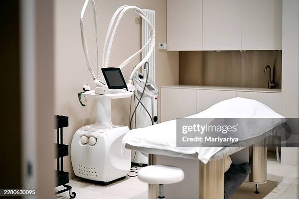 empty beauty salon room with modern medical equipment - beauty treatment stock pictures, royalty-free photos & images