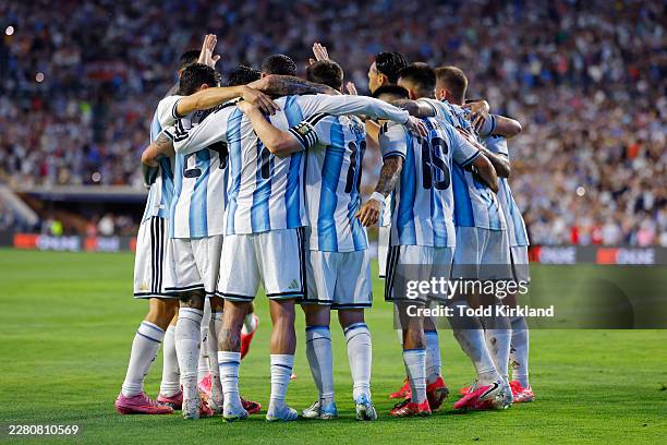 Lionel Messi of Argentina celebrates with teammates after scoring the team's second goal during the international friendly match between Argentina...