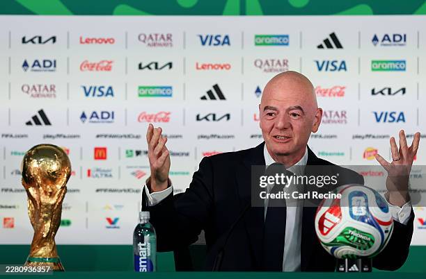 Gianni Infantino, President of FIFA, speaks to the media alongside the FIFA World Cup trophy during a FIFA World Cup 2026 Opening Press Conference at...