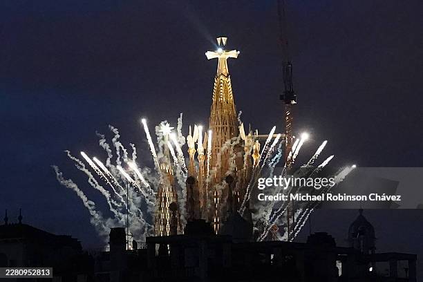 Fireworks are set off around the Basilica of the Sagrada Familia after Pope Leo XIV blessed Jesus Christ tower during its inauguration on June 10,...