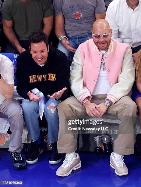 Talk Show Host Jimmy Fallon and superfan Fat Joe cheer on the New York Knicks against the San Antonio Spurs during the first quarter of Game 4 of the...