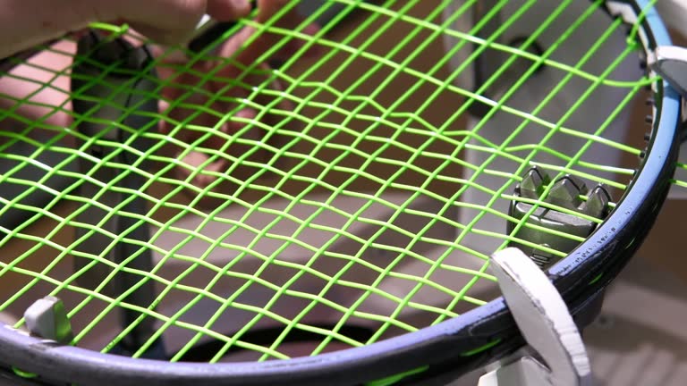 https://media.gettyimages.com/id/2281114309/video/tennis-racket-being-restrung-with-bright-green-tennis-strings-on-stringing-machine-hands.jpg?b=1&s=640x640&k=20&c=IanhC09JFNIxTvi8FGLwsxETo70V4SKGA-KNftE4Avo=