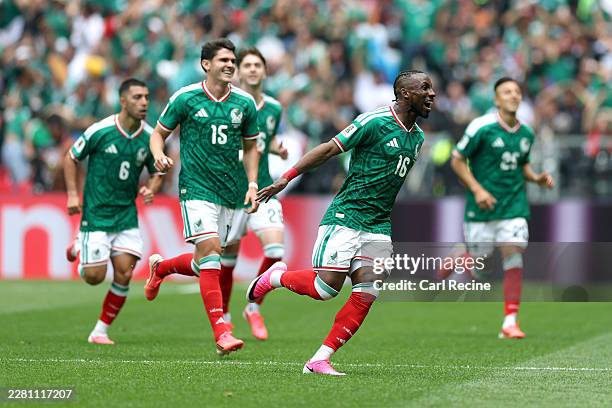 Julian Quinones of Mexico celebrates with teammates after scoring the team's first goal during the FIFA World Cup 2026 Group A match between Mexico...