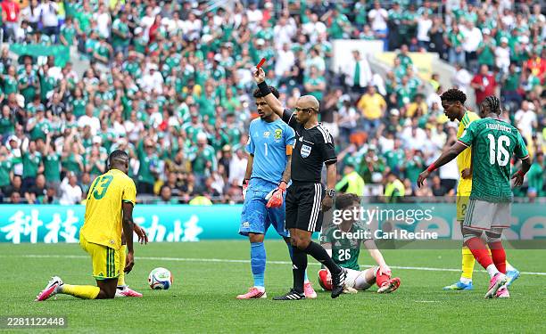 Referee Wilton Sampaio issues a red card to Sphephelo Sithole of South Africa during the FIFA World Cup 2026 Group A match between Mexico and South...