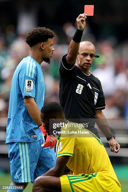Referee Wilton Sampaio issues a red card to Sphephelo Sithole of South Africa during the FIFA World Cup 2026 Group A match between Mexico and South...