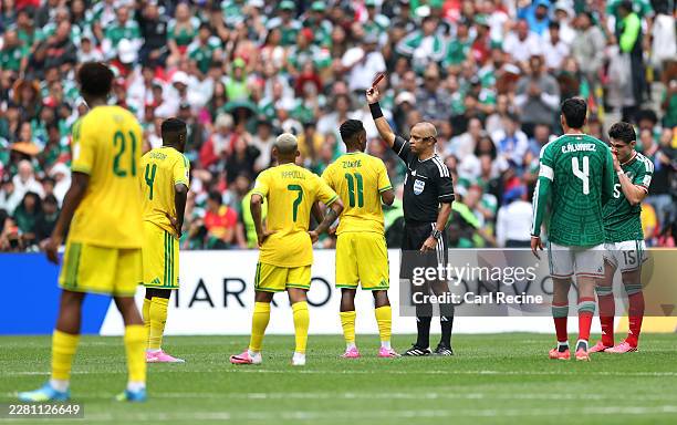 Referee Wilton Sampaio issues a red card to Themba Zwane of South Africa during the FIFA World Cup 2026 Group A match between Mexico and South Africa...