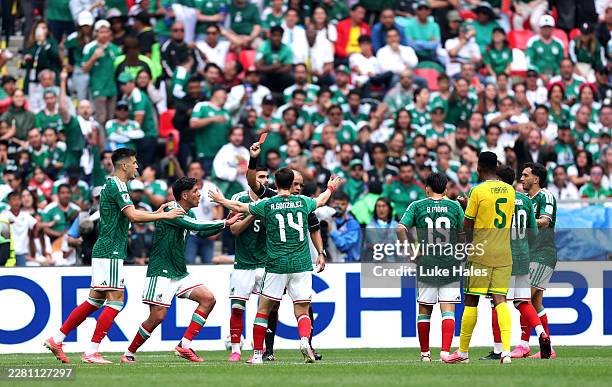 Referee Wilton Sampaio issues a red card to Cesar Montes of Mexico during the FIFA World Cup 2026 Group A match between Mexico and South Africa at...