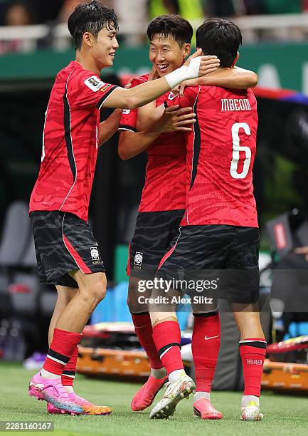 In-Beom Hwang of Korea Republic celebrates scoring his team's first goal with Heung-Min Son during the FIFA World Cup 2026 Group A match between...