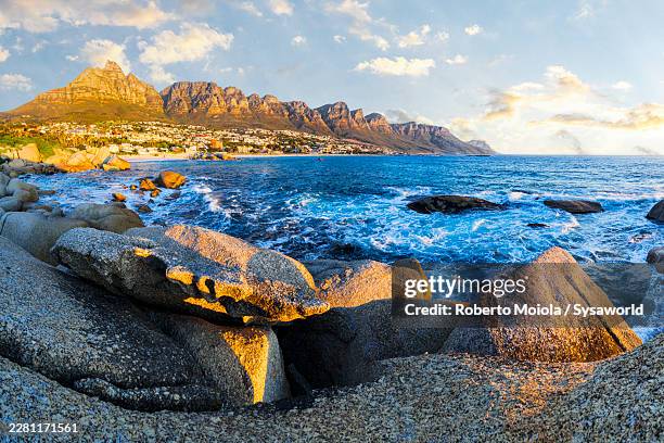 ocean waves crashing on rocks, cape town - camps bay stock pictures, royalty-free photos & images