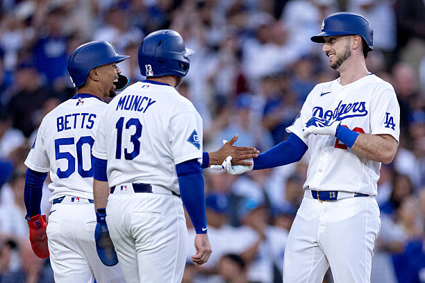 Los Angeles, CA Los Angeles Dodgers shortstop Mookie Betts congratulates right fielder Kyle Tucker for hitting a home run during the second inning of...