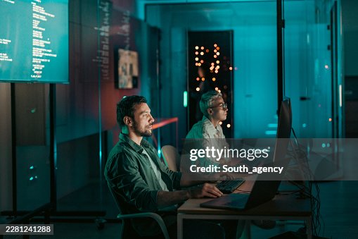 High-tech IT team collaborating on software development project High-tech IT team collaborating on software development project