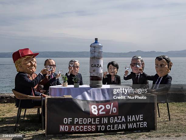 Oxfam activists dressed up with caricature "big heads" representing the G7 heads of state and governments the US President Donald Trump, Prime...