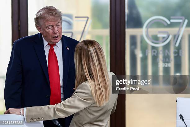 President Donald Trump speaks with Italian Prime Minister Giorgia Meloni at a working lunch with leaders of G7 and the Middle East, on June 16, 2026...