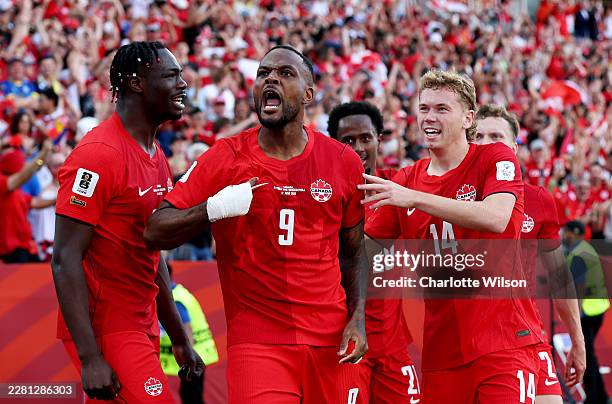 Cyle Larin of Canada celebrates with teammates after scoring the team's first goal during the FIFA World Cup 2026 Group B match between Canada and...