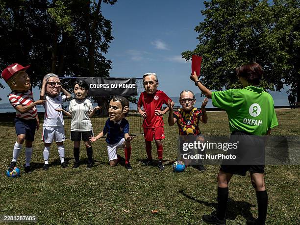 Oxfam activists dressed up with caricature "big heads" and national football colours representing the G7 heads of state and governments the US...