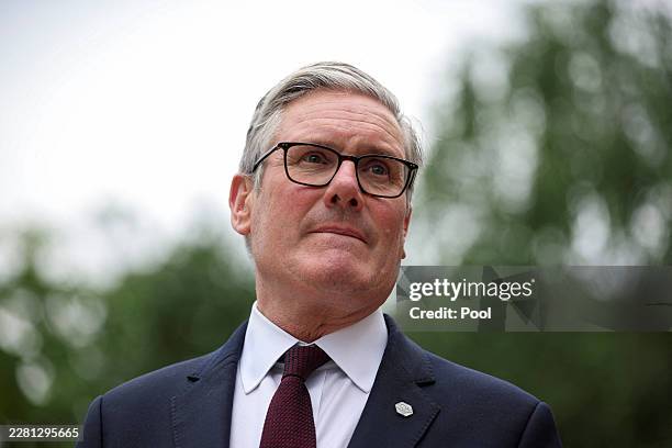 British Prime Minister Keir Starmer looks on as he awaits Switzerland's Federal President Guy Parmelin on the sidelines of the G7 summit on June 16,...