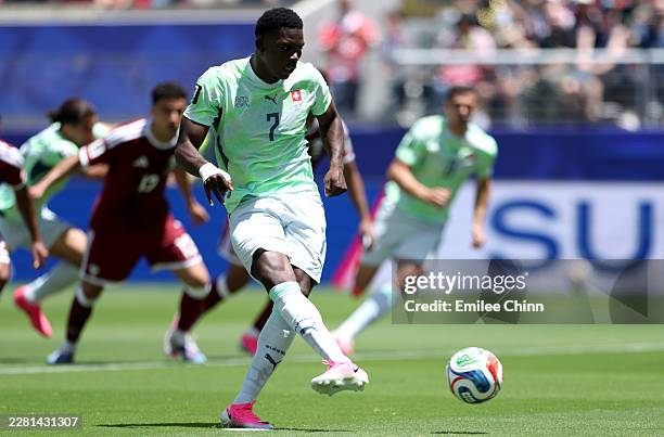 Breel Embolo of Switzerland scores a penalty for his team's first goal during the FIFA World Cup 2026 Group B match between Qatar and Switzerland at...