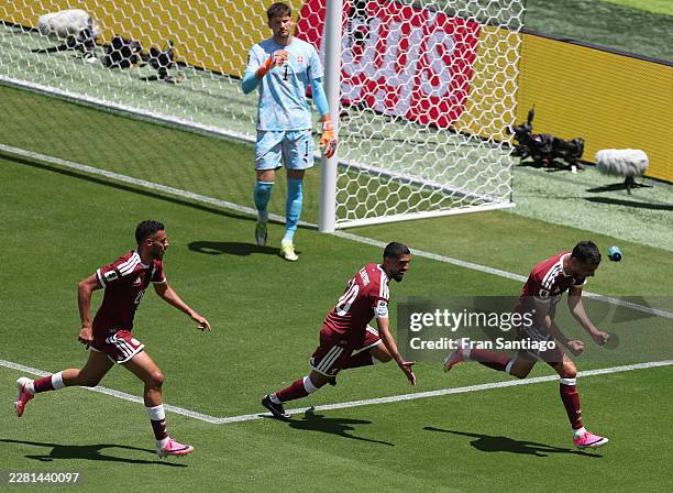 Boualem Khoukhi of Qatar celebrates with teammates after scoring the team's first goal during the FIFA World Cup 2026 Group B match between Qatar and...