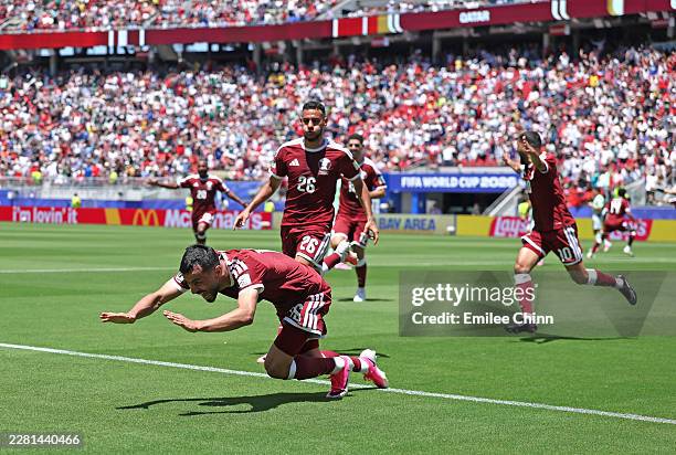 Boualem Khoukhi of Qatar celebrates scoring his team's first goal during the FIFA World Cup 2026 Group B match between Qatar and Switzerland at San...