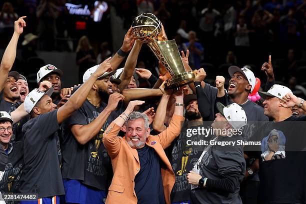 New York Knicks owner James Dolan and president Leon Rose lift the Larry O'Brien Championship Trophy after their team defeated the San Antonio Spurs...