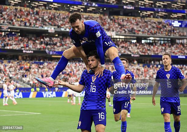 Martin Baturina of Croatia celebrates scoring their first goal with Ivan Perisic during the FIFA World Cup 2026 Group L match between England and...