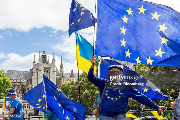 Anti-Brexit protesters gather with European Union and Ukrainian flags near the Houses of Parliament in London, UK, on Wednesday, June 17, 2026....