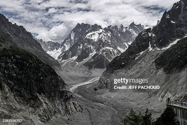 This photograph shows the Mont-Blanc massif mountains and the "Mer de Glace" glacier seen from the Montenvers train from Chamonix to the Montenvers -...