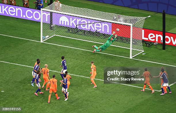 Koki Ogawa of Japan heads the ball, which is deflected off the head of Daichi Kamada for the team's second goal during the FIFA World Cup 2026 Group...