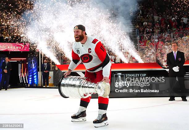 Jordan Staal of the Carolina Hurricanes prepares to hoist the Stanley Cup after defeating the Vegas Golden Knights in Game Six of the 2026 NHL...