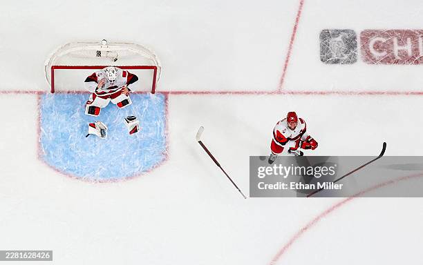 Brandon Bussi and Jaccob Slavin of the Carolina Hurricanes celebrate their 3-0 victory over the Vegas Golden Knights to win Game Six of the 2026 NHL...