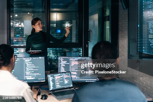 Software developer team working together, discussing on coding on multi computer screen. Software developer team working together, discussing on coding on multi computer screen.