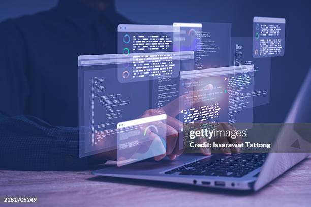 programmer working with artificial intelligence and advanced data analytics on a futuristic code interface, developing machine learning solutions, software systems, and digital innovation - software programmer stock pictures, royalty-free photos & images