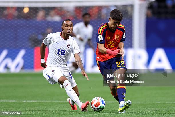 Pau Cubarsi of Spain passes the ball under pressure from Dailon Livramento of Cabo Verde during the FIFA World Cup 2026 Group H match between Spain...