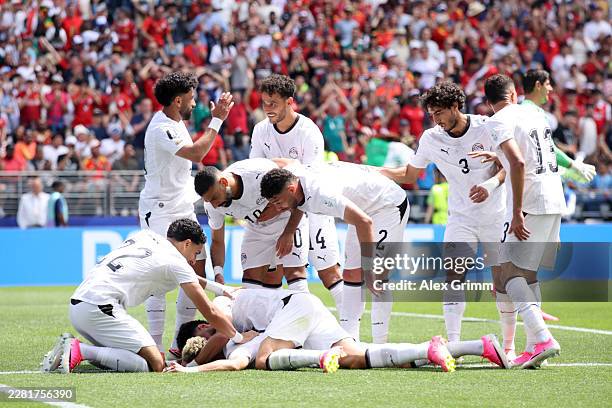 Emam Ashour of Egypt celebrates with teammates after scoring the team's first goal during the FIFA World Cup 2026 Group G match between Belgium and...