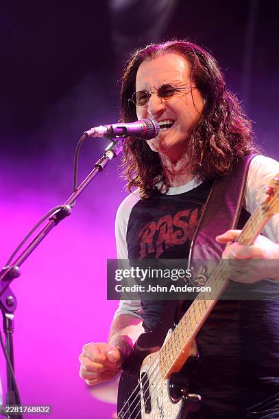 Canadian Rock musician Geddy Lee, of the group Rush, plays bass guitar as he performs onstage at the Frank Erwin Center, Austin, Texas, June 12, 2011.