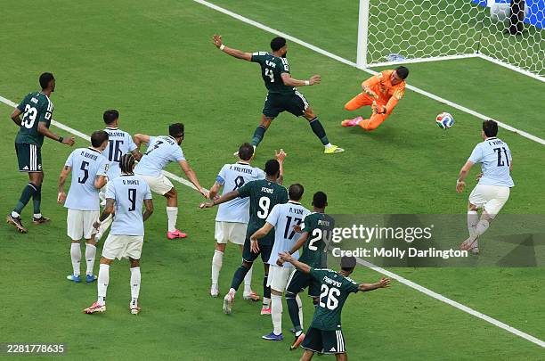 Abdulelah Al-Amri of Saudi Arabia scores his team's first goal past Fernando Muslera of Uruguay during the FIFA World Cup 2026 Group H match between...