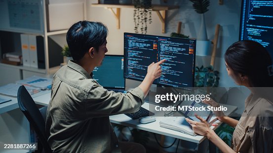 Team young Asian computer programmers discuss software development working late at night in the office. Partnership teamwork plan, artificial intelligence data science, business connection concepts. Team young Asian computer programmers discuss software development working late at night in the office. Partnership teamwork plan, artificial intelligence data science, business connection concepts.