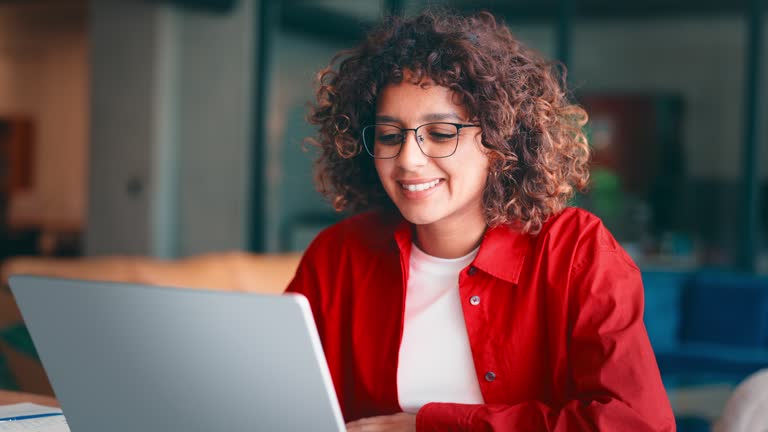 https://media.gettyimages.com/id/2281909932/video/young-indian-woman-with-curly-hair-and-glasses-working-on-laptop-computer-at-desk-in-modern.jpg?b=1&s=640x640&k=20&c=z8Ik7CqrhzyF6bH27Tl3AxC7nmziNDrHyPFfu-vvAv0=