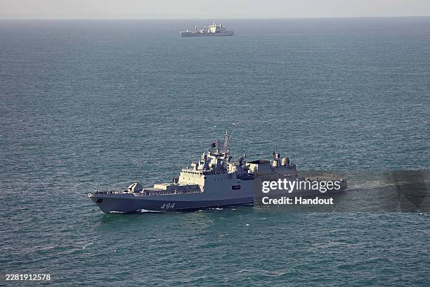 In this undated handout image provided by the UK Ministry of Defence, the Russian frigate Admiral Grigorovich is monitored by the Royal Navy's RFA...