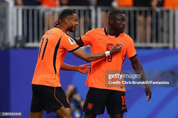 Brian Brobbey of the Netherlands celebrates scoring a goal to make the score 1-0 with team-mate Cody Gakpo during the FIFA World Cup 2026 Group F...