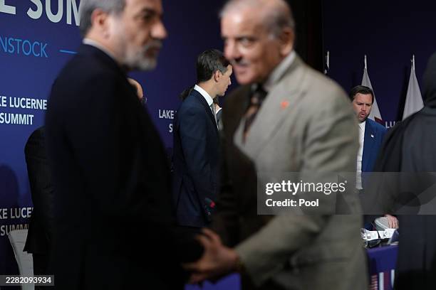Vice President JD Vance looks on next to U.S. President Donald Trump's son-in-law Jared Kushner, as Iran's Foreign Minister Abbas Araqchi shakes...