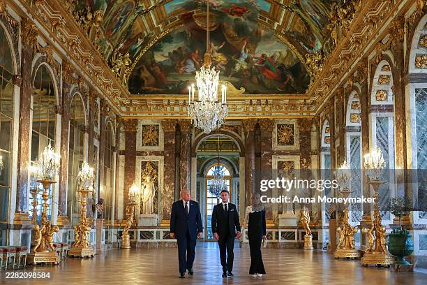 President Donald Trump receives a tour of Chateau de Versailles from President of France Emmanuel Macron and his wife Brigitte Macron ahead of a...