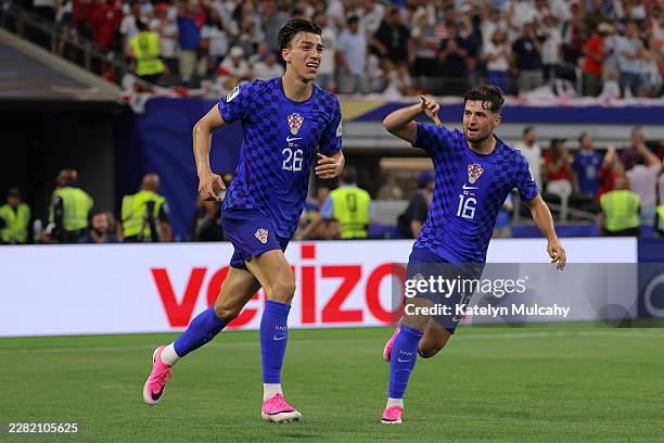 Petar Musa of Croatia celebrates scoring his team's second goal during the FIFA World Cup 2026 Group L match between England and Croatia at Dallas...