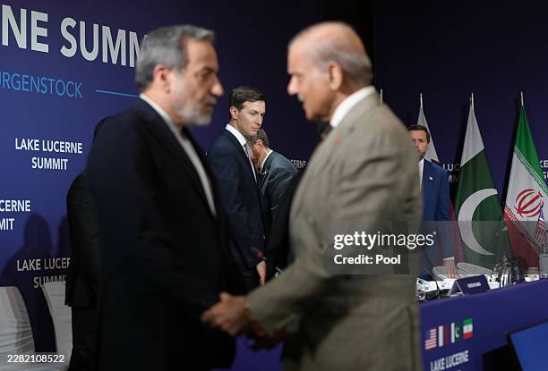 Vice President JD Vance looks on next to U.S. President Donald Trump's son-in-law Jared Kushner, as Iran's Foreign Minister Abbas Araqchi shakes...
