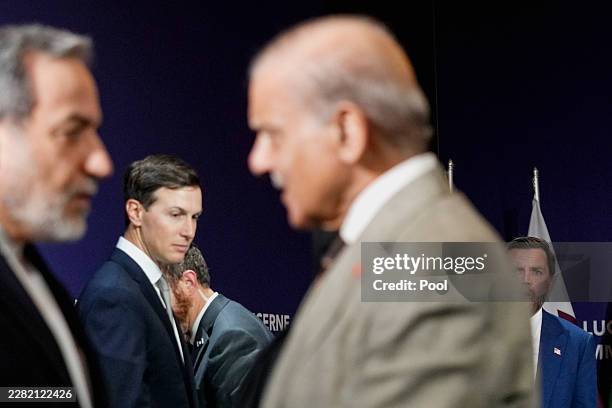 Vice President JD Vance looks on next to U.S. President Donald Trump's son-in-law Jared Kushner, as Iran's Foreign Minister Abbas Araqchi shakes...